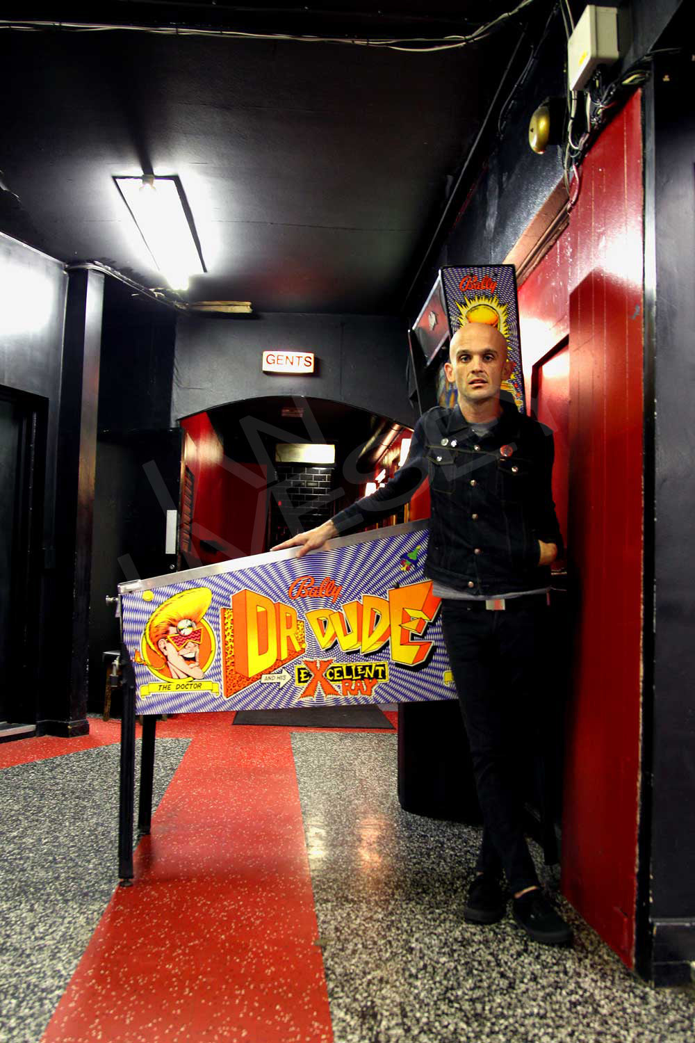 Zach Blair in front of the Dr Dude Pinball machine - Limited Print Run